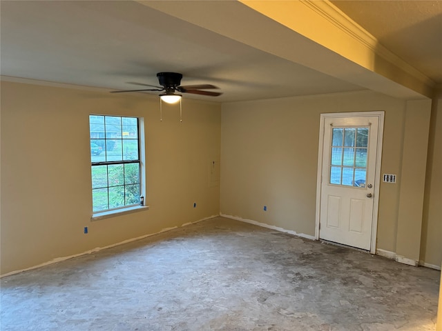 foyer entrance featuring ceiling fan and crown molding