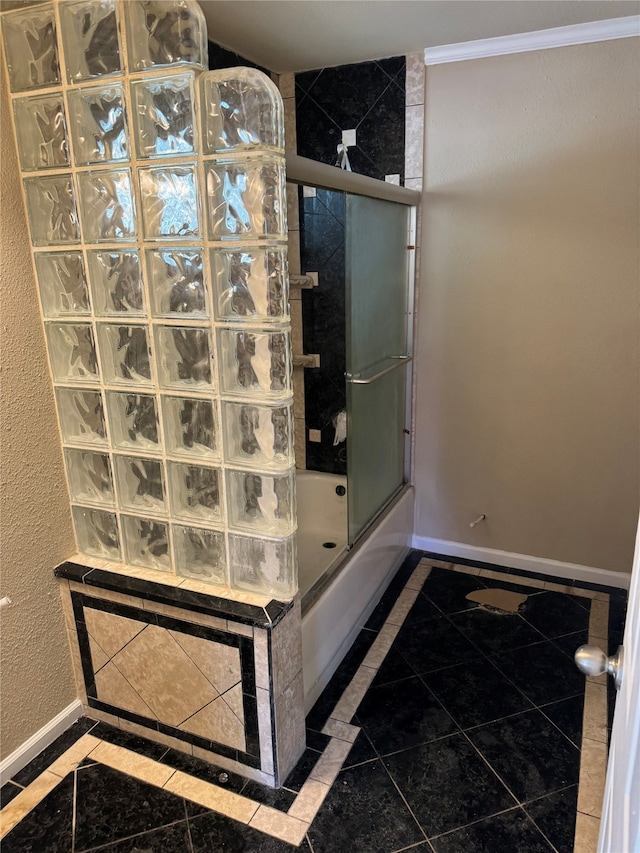 411 Lawrence Rd, Trinity, TX 75862 - bathroom with inlaid floor details, bath / shower combo with glass door, and tile patterned flooring