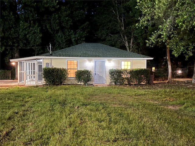 411 Lawrence Rd, Trinity, TX 75862 - view of front of home with a shingled roof and a front lawn