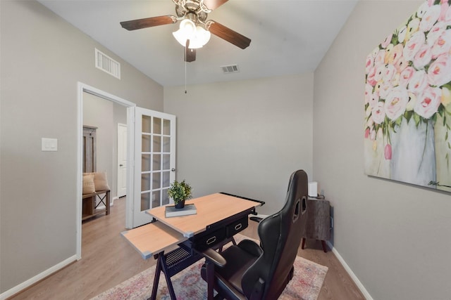 home office featuring ceiling fan and light wood-type flooring