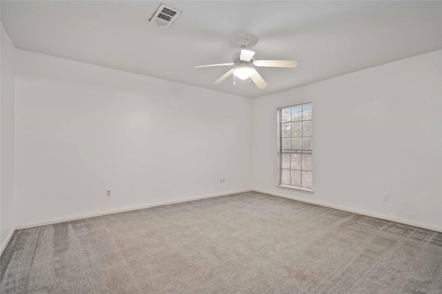 unfurnished room featuring carpet flooring and ceiling fan