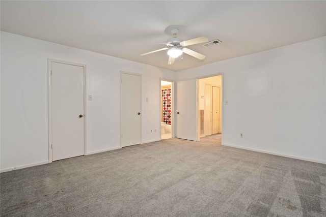 unfurnished bedroom featuring ceiling fan and light carpet