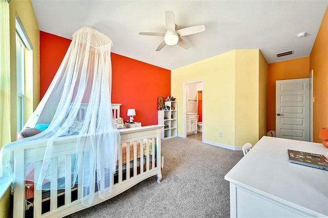 bedroom featuring carpet flooring, ceiling fan, and ensuite bathroom