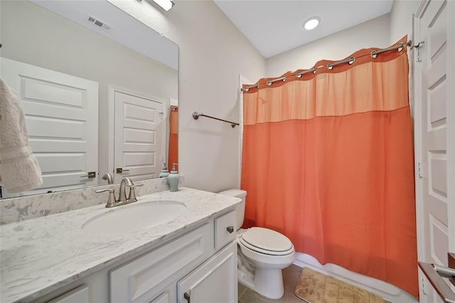 full bathroom featuring tile patterned flooring, vanity, toilet, and shower / bathtub combination with curtain