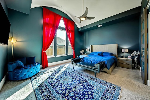 carpeted bedroom with vaulted ceiling and ceiling fan