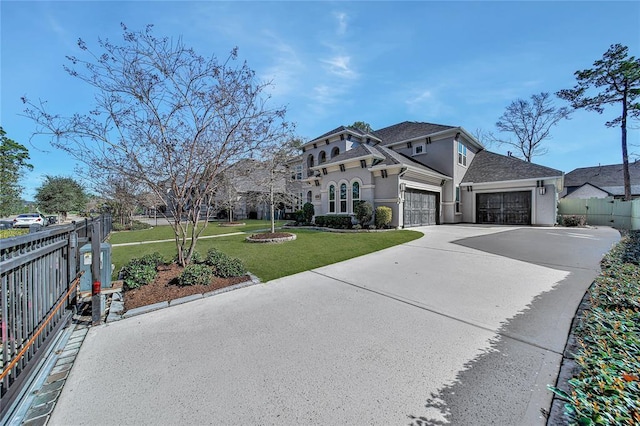 view of front facade with a front yard and a garage