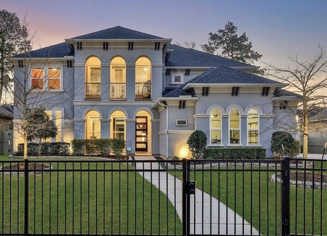 italianate house with a lawn and a balcony