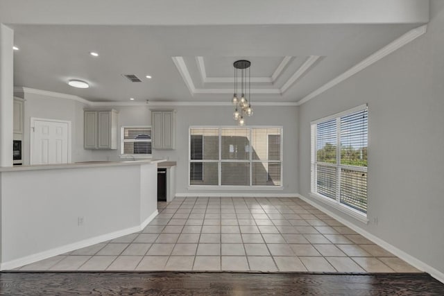 interior space featuring ornamental molding, a notable chandelier, and light wood-type flooring