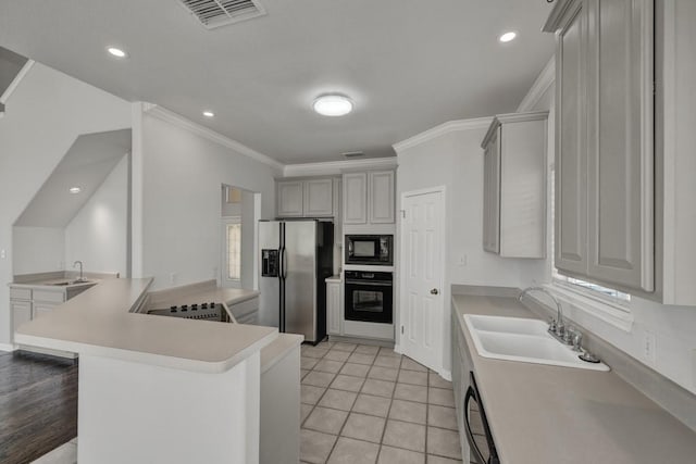 kitchen featuring black appliances, crown molding, sink, gray cabinets, and kitchen peninsula