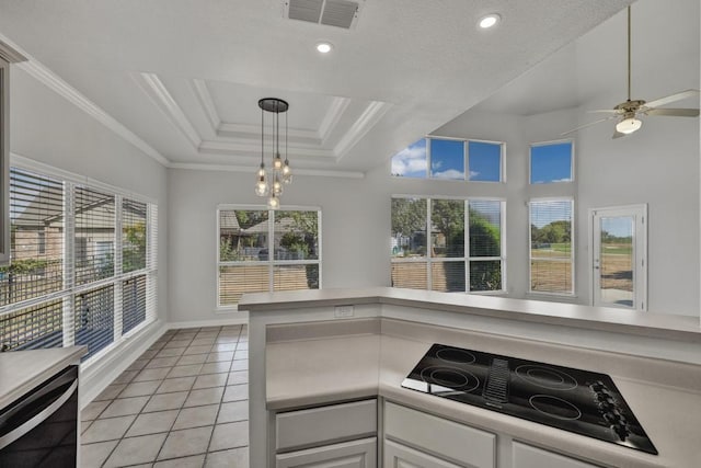 kitchen with black appliances, ceiling fan with notable chandelier, white cabinets, crown molding, and light tile patterned floors