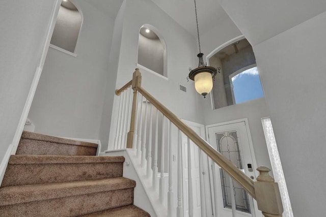 stairway with a high ceiling