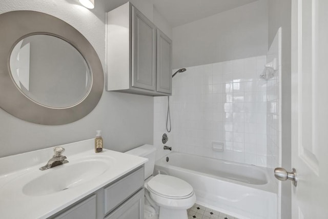 full bathroom featuring tile patterned floors, tiled shower / bath combo, toilet, and vanity