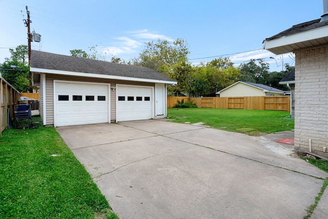 garage featuring a yard