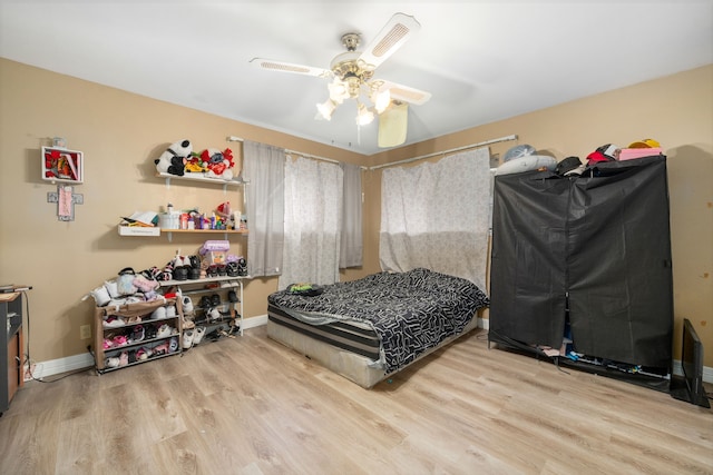 bedroom featuring ceiling fan and light wood-type flooring