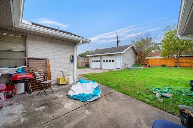 exterior space with a garage, an outdoor structure, and a grill