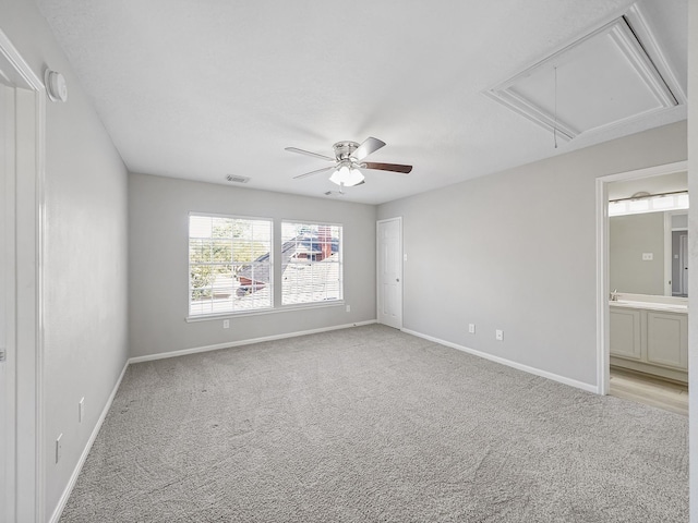 carpeted empty room featuring ceiling fan