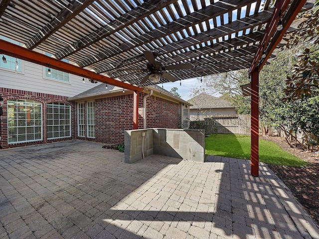 view of patio / terrace featuring ceiling fan and a pergola