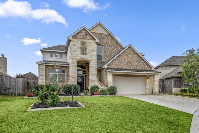 view of front of property featuring a garage and a front lawn