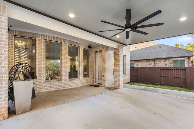 view of patio / terrace featuring ceiling fan and fence