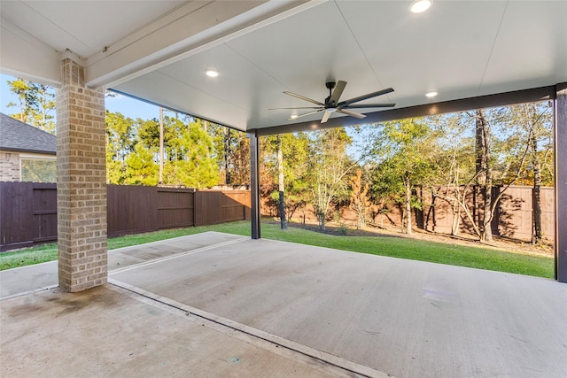 view of patio with a fenced backyard and a ceiling fan