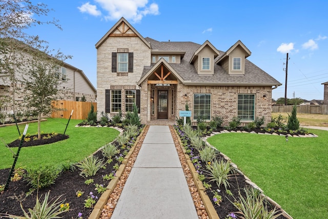 craftsman house with a front lawn