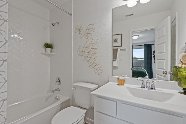 full bathroom with vanity, toilet, and tiled shower / bath