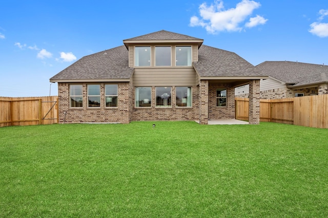 back of property featuring a lawn and a patio area