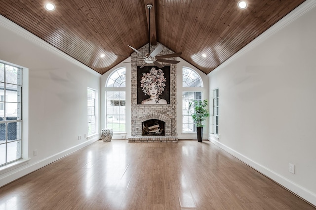 unfurnished living room with hardwood / wood-style flooring, a brick fireplace, ceiling fan, and wooden ceiling