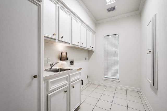 laundry room featuring sink, washer hookup, cabinets, hookup for an electric dryer, and ornamental molding