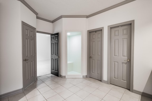 unfurnished bedroom featuring crown molding and light tile patterned floors