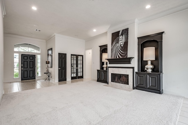 carpeted living room with a textured ceiling and ornamental molding