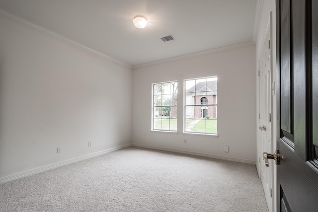 unfurnished room with light colored carpet and ornamental molding