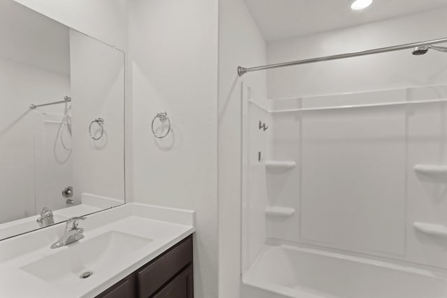 bathroom with vanity and shower / tub combination