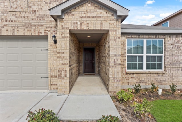 doorway to property featuring a garage