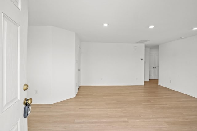 spare room with light hardwood / wood-style floors