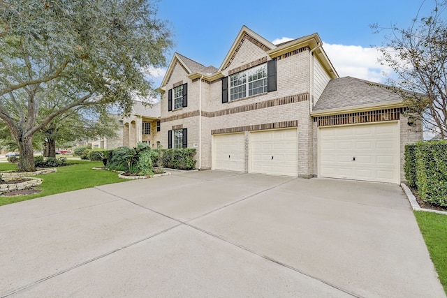 view of front of property with a front lawn and a garage