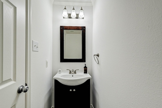 bathroom featuring vanity and crown molding