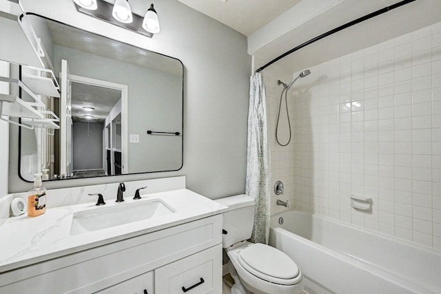 full bathroom with shower / tub combo with curtain, vanity, and toilet