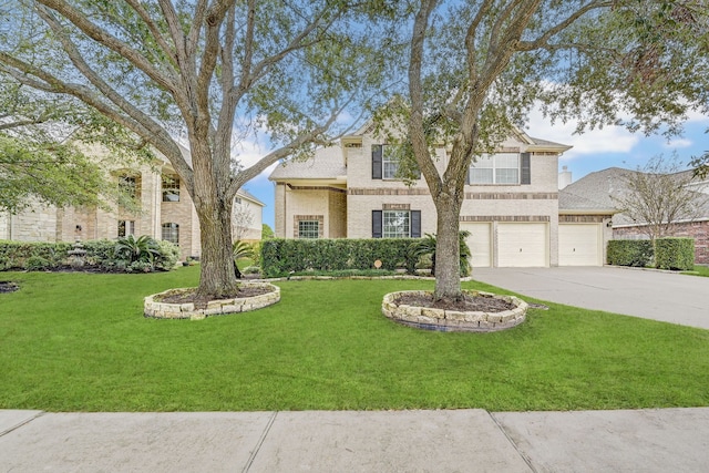 view of front of home with a front yard and a garage