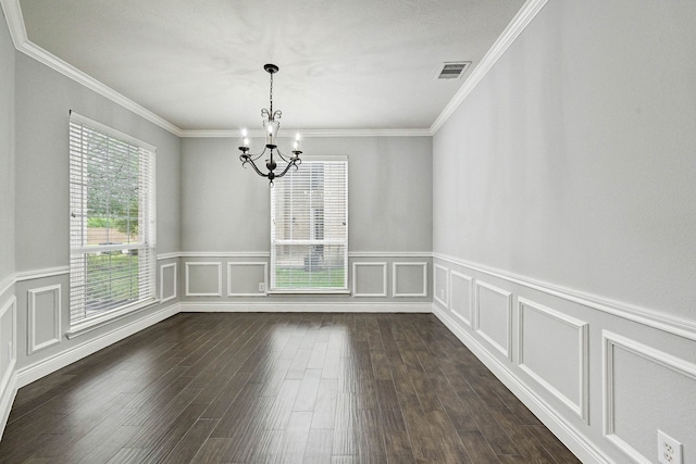 unfurnished room with ornamental molding, dark hardwood / wood-style flooring, and a notable chandelier