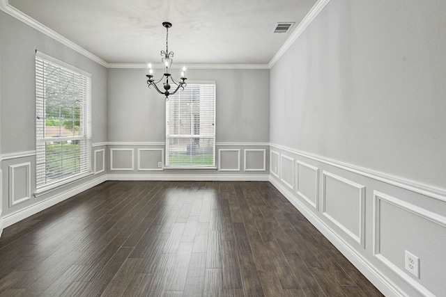 unfurnished room featuring a chandelier, a wealth of natural light, crown molding, and dark wood-type flooring