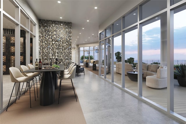 dining area featuring floor to ceiling windows, a wealth of natural light, and recessed lighting