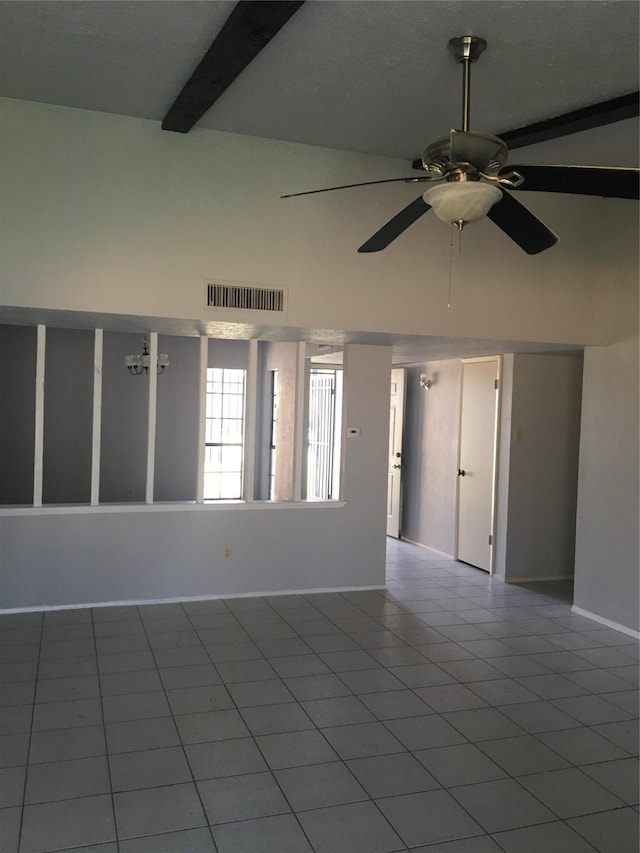 spare room featuring beamed ceiling, high vaulted ceiling, tile patterned floors, and ceiling fan