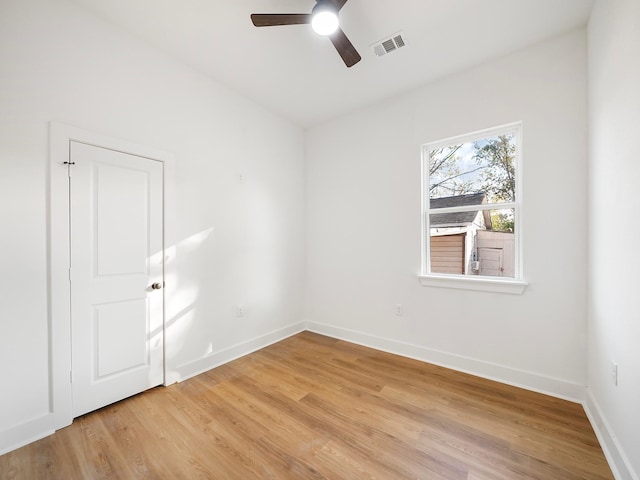 spare room with ceiling fan and light hardwood / wood-style flooring