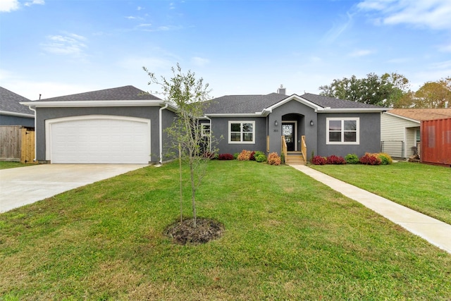 single story home with a garage and a front lawn