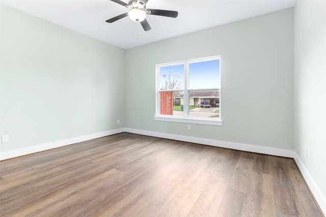 unfurnished room featuring ceiling fan and light wood-type flooring