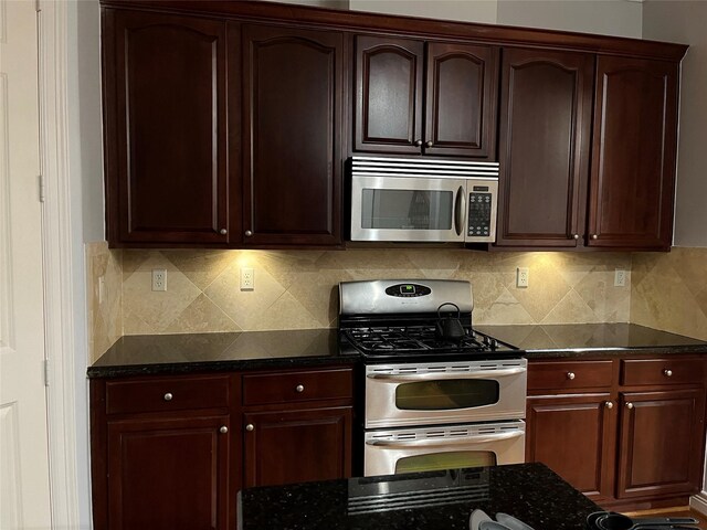 kitchen with tasteful backsplash and stainless steel appliances