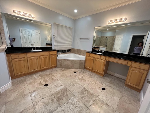 bathroom with vanity, separate shower and tub, and ornamental molding