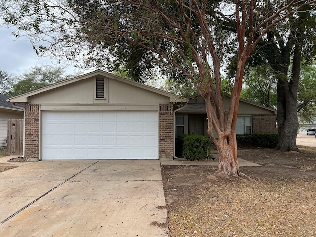 ranch-style house featuring a garage