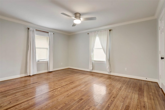 empty room with ceiling fan, light hardwood / wood-style flooring, and ornamental molding